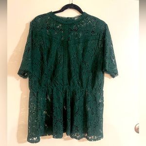 Very cute green top, to be worn with an undershirt or a bralette.